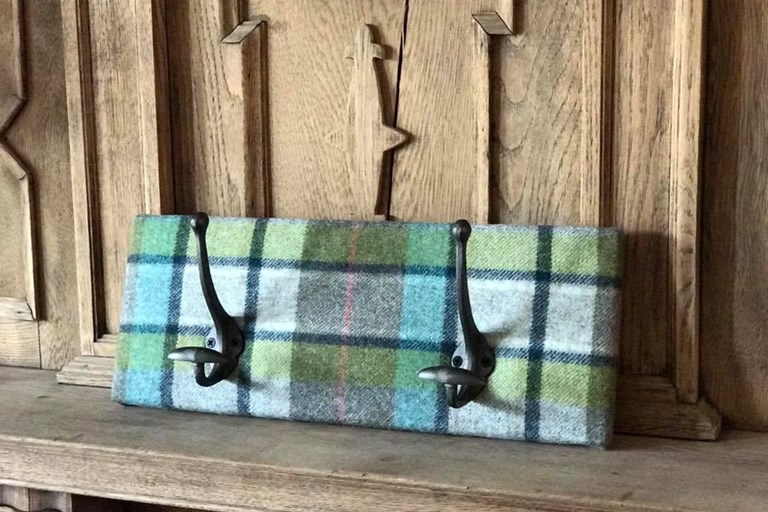 Cast iron coat hooks on tartan Cast iron coat hooks on tartan